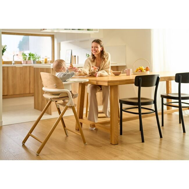 Scaun de masa multifunctional Celia, Lionelo, Din lemn de fag, 6 luni- adult, Reglabil pe inaltime, Spatar lat, Sezut ergonomic, Tavita silicon, Suport de picioare reglabil, Greutate maxima 90 Kg, Alb/Natural BYNLO-CELIA_WHITE_NATURAL_WOOD