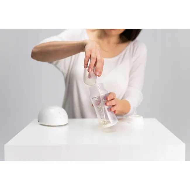 Pompa de san, Lionelo, Fidi, Portabila, Cu accesorii, Hands-free, 5 functii de masaj, Autonomie pana la 24 h, 50 db, Capacitate 150 ml, Alb BYNLOC-FIDI_FREE_WHITE