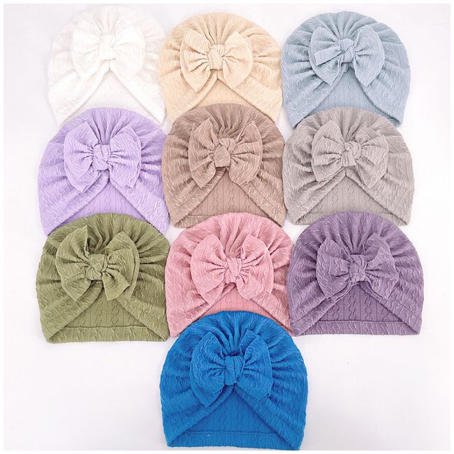 Caciulita tip turban cu model din tesatura si funda aplicata AMx-22032